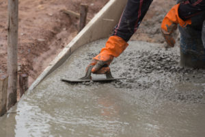 contractor installing concrete