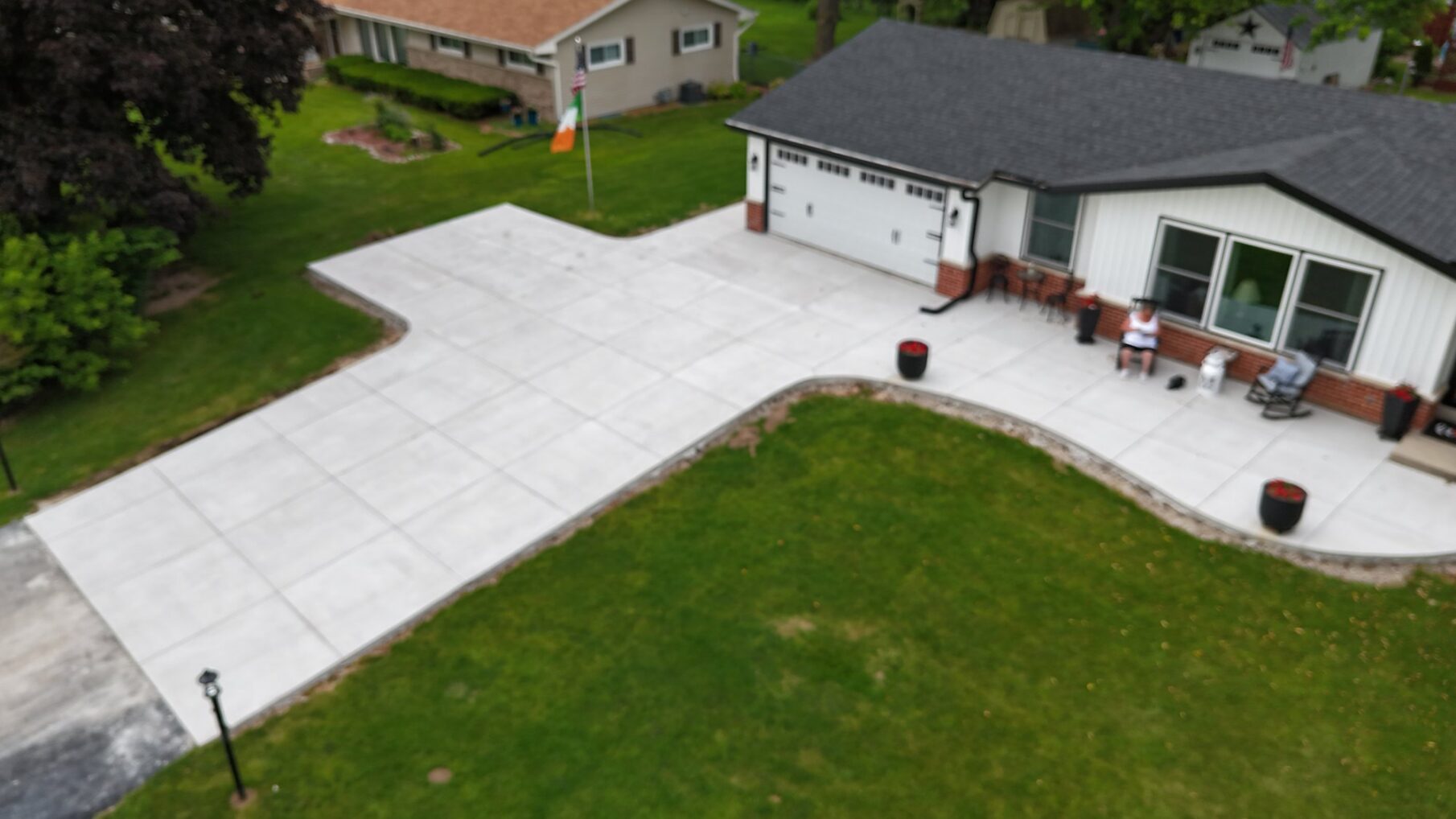 Aerial view of a new concrete driveway and walkway installed by JBS Construction in Germantown, WI