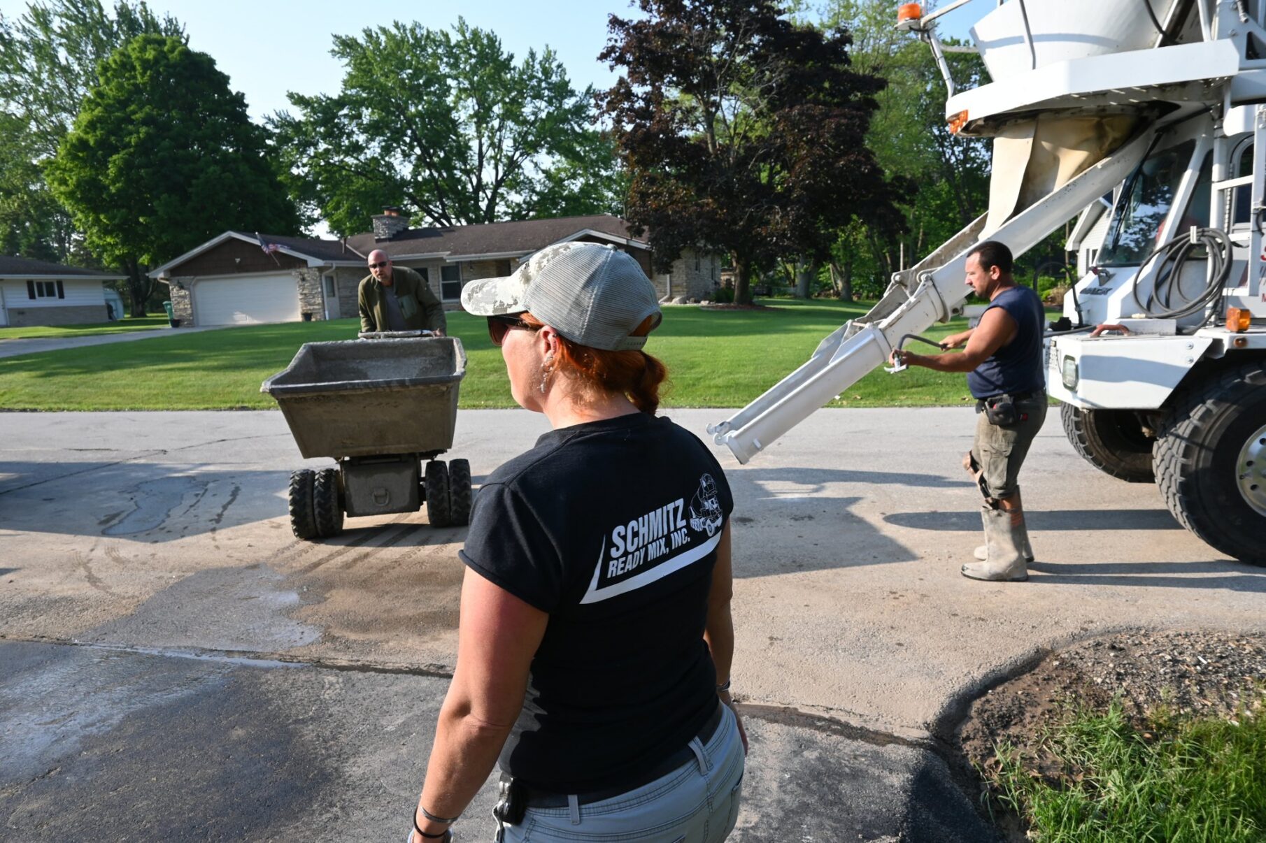 Brian beside the concrete truck; the Schmitz Ready Mix driver is in the foreground.