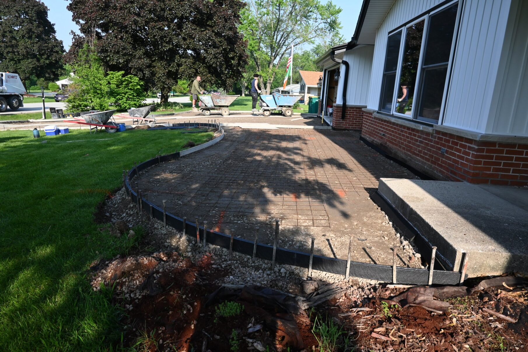 Curved forms establish the front walkway layout.